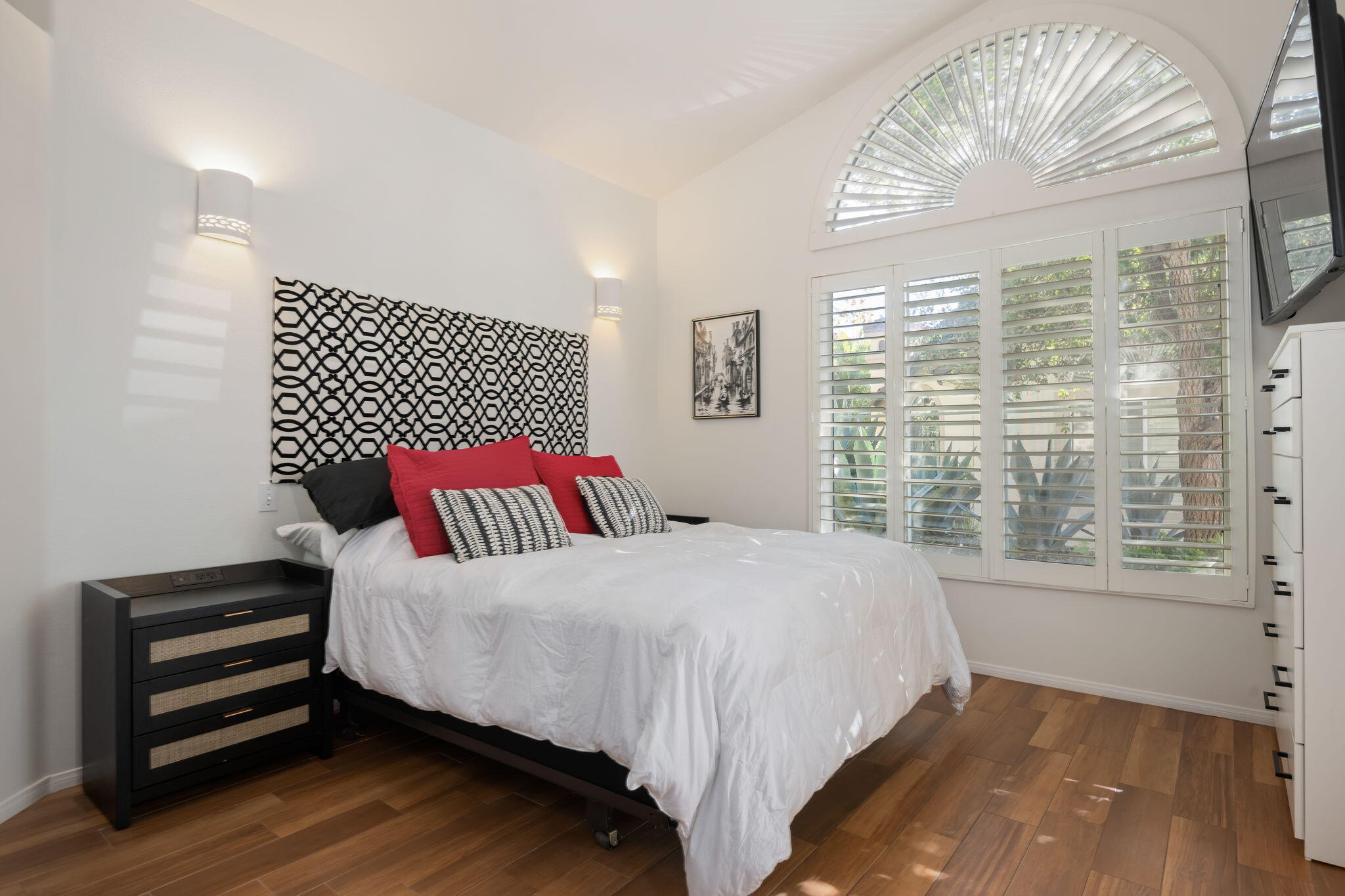 1260 Cravens Lane, Unit 2 Carpinteria, CA 93013 - Photo 10 of 23 a bedroom with a bed and a large window