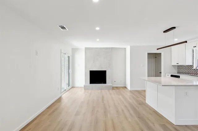 a view of a kitchen with a sink and a microwave