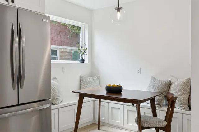 a view of kitchen with furniture and a window