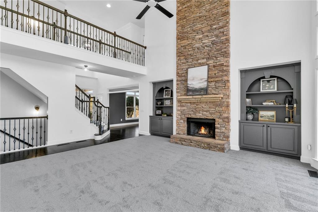 271 Ivy Hall Lane Dallas, GA 30132 - Photo 11 of 120 a view of a livingroom with an empty kitchen and a fireplace