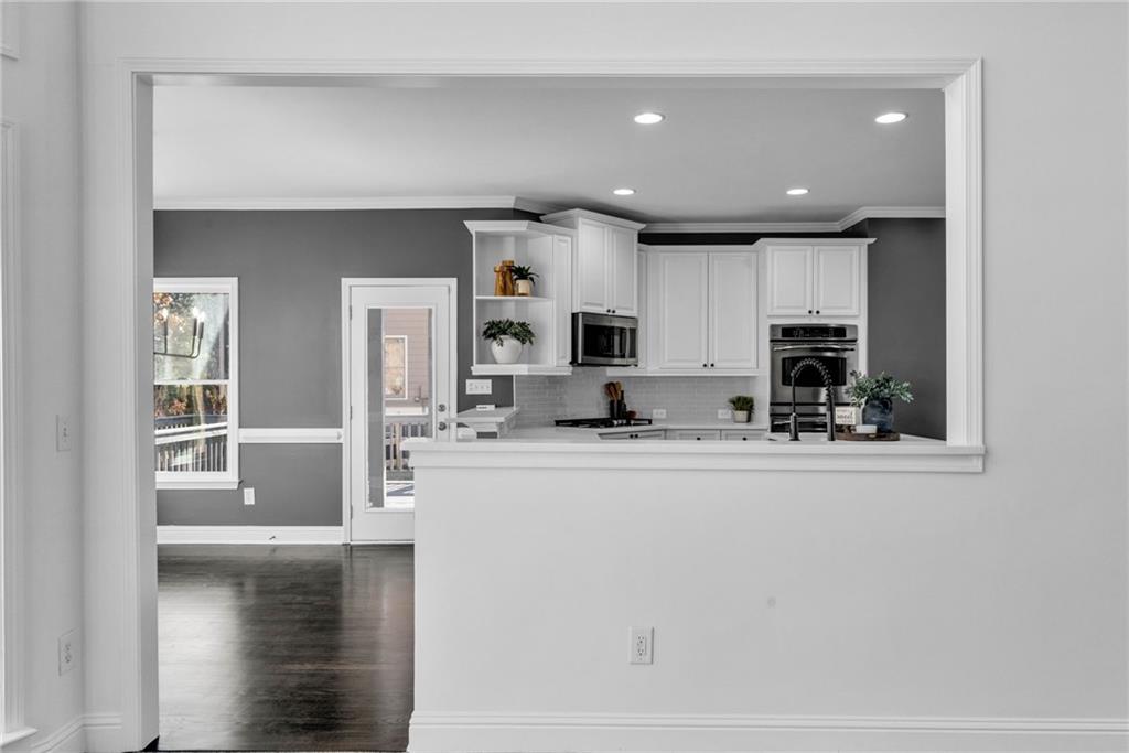 271 Ivy Hall Lane Dallas, GA 30132 - Photo 14 of 120 a kitchen with stainless steel appliances granite countertop a refrigerator and a stove top oven