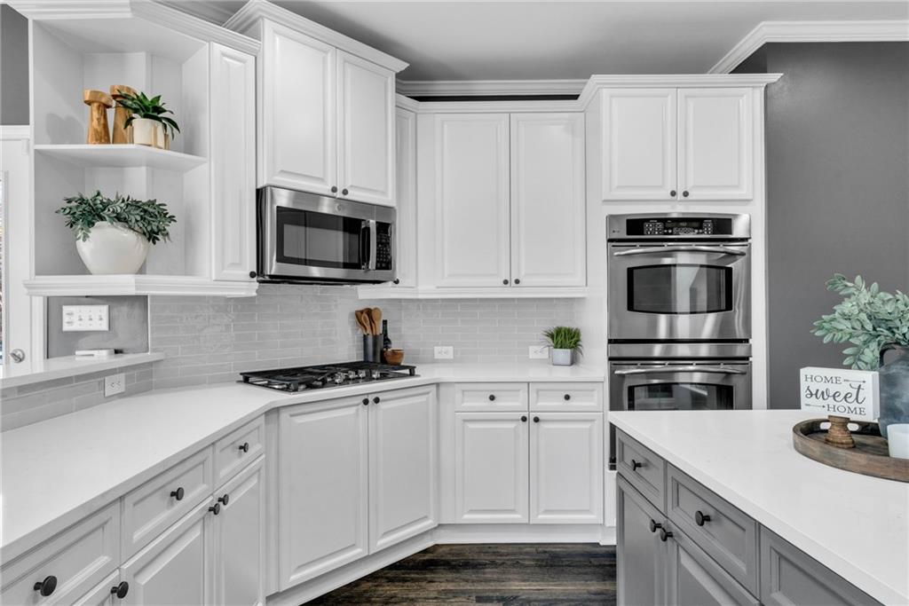 271 Ivy Hall Lane Dallas, GA 30132 - Photo 16 of 120 a kitchen with white cabinets and appliances