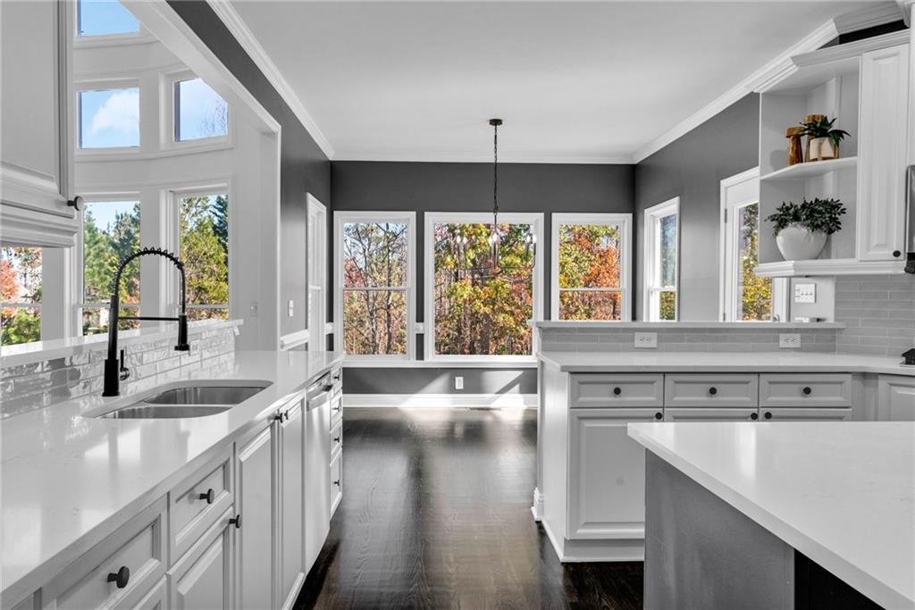 271 Ivy Hall Lane Dallas, GA 30132 - Photo 26 of 120 a kitchen with stainless steel appliances granite countertop a sink a stove and a wooden floors
