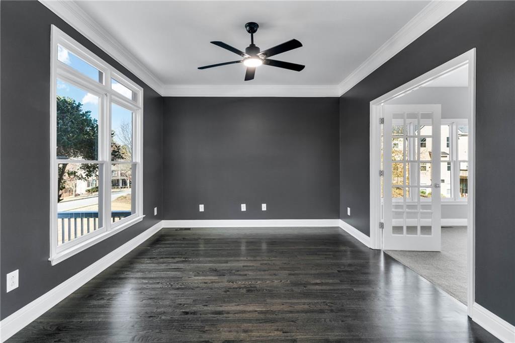 271 Ivy Hall Lane Dallas, GA 30132 - Photo 38 of 120 a view of an empty room with wooden floor and a window
