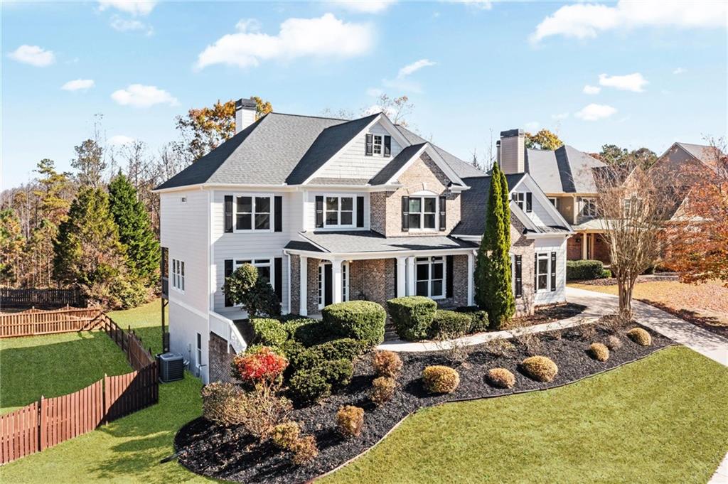 271 Ivy Hall Lane Dallas, GA 30132 - Photo 4 of 120 a front view of a house with a yard potted plants and a large tree