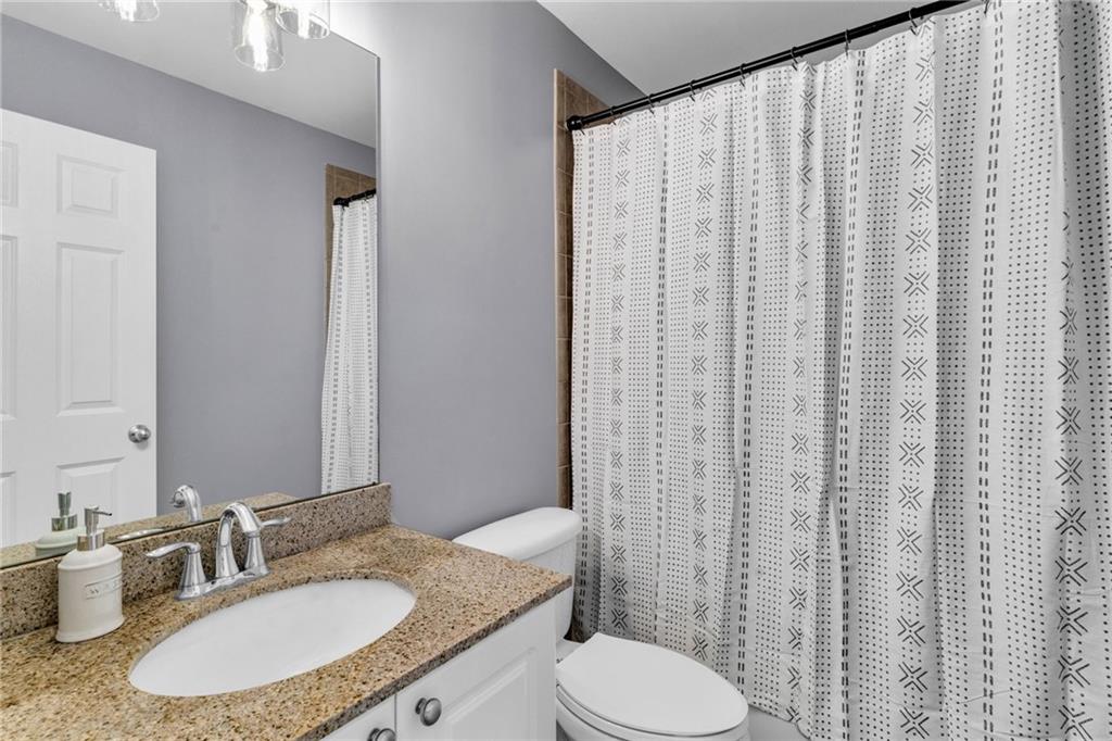 271 Ivy Hall Lane Dallas, GA 30132 - Photo 61 of 120 a bathroom with a granite countertop sink and a mirror