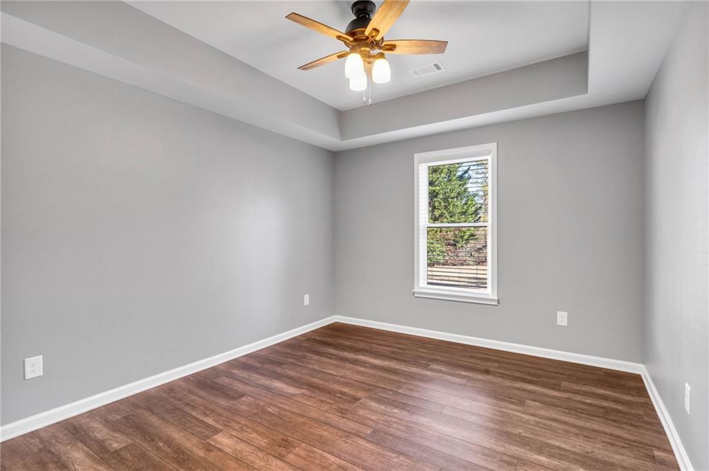 271 Ivy Hall Lane Dallas, GA 30132 - Photo 79 of 120 a view of an empty room with window and wooden floor