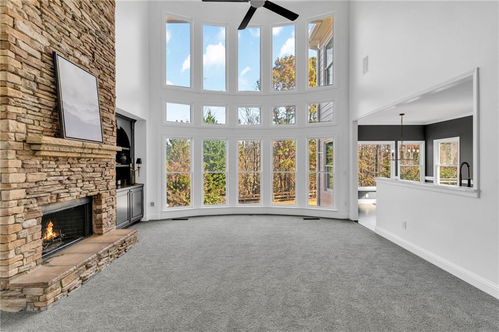 271 Ivy Hall Lane Dallas, GA 30132 - Photo 9 of 120 a view of an empty room with a fireplace and a window