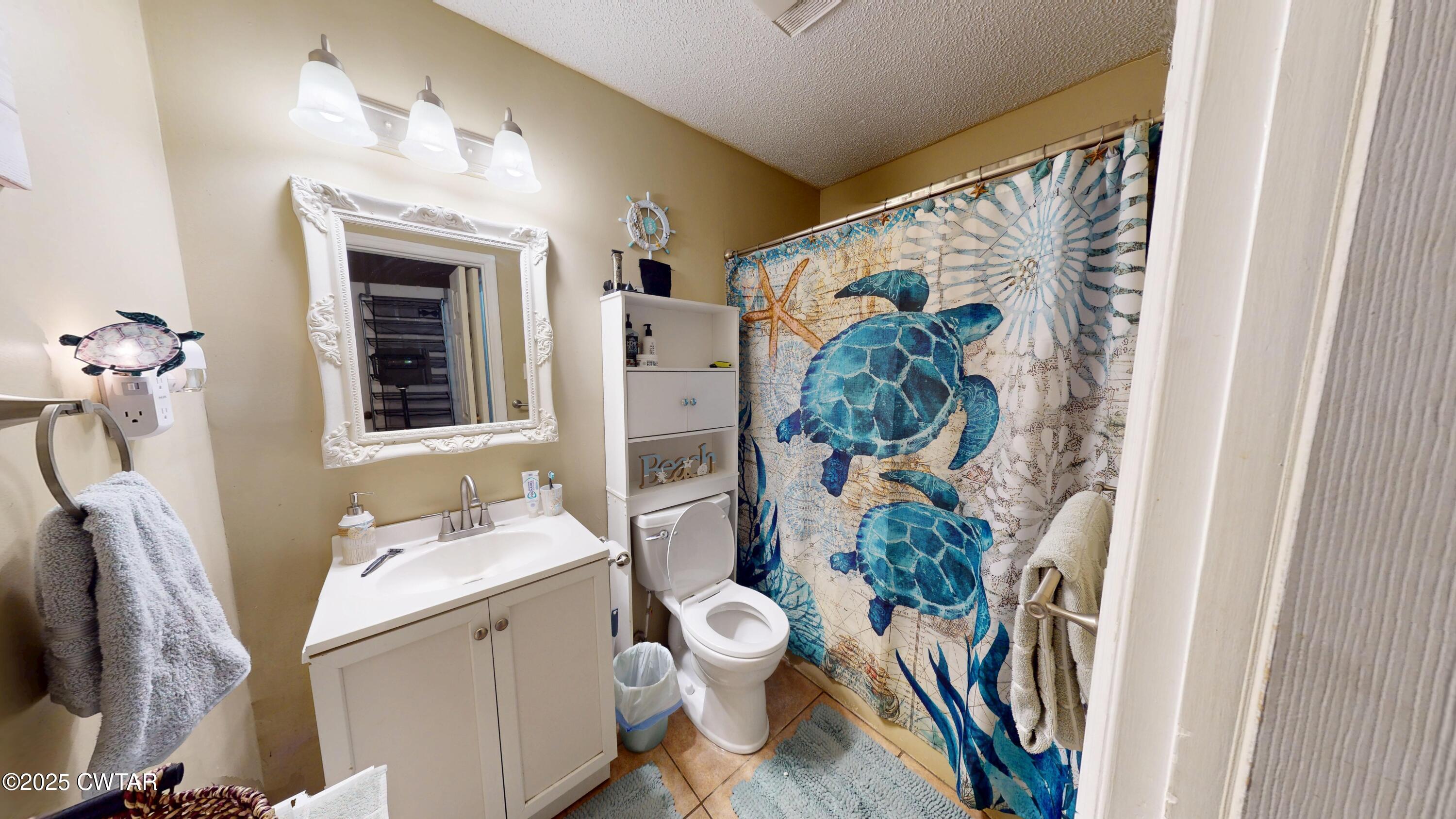 625 Hanna Drive Ripley, TN 38063 - Photo 11 of 26 a bathroom with a sink mirror vanity and toilet