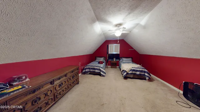a view of gym equipment with wooden floor
