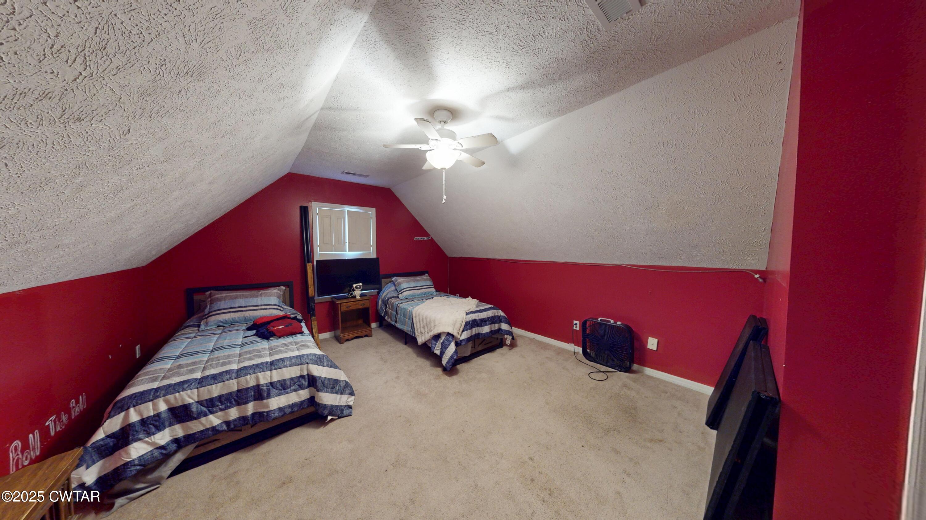 625 Hanna Drive Ripley, TN 38063 - Photo 14 of 26 a bedroom with a bed and a chandelier