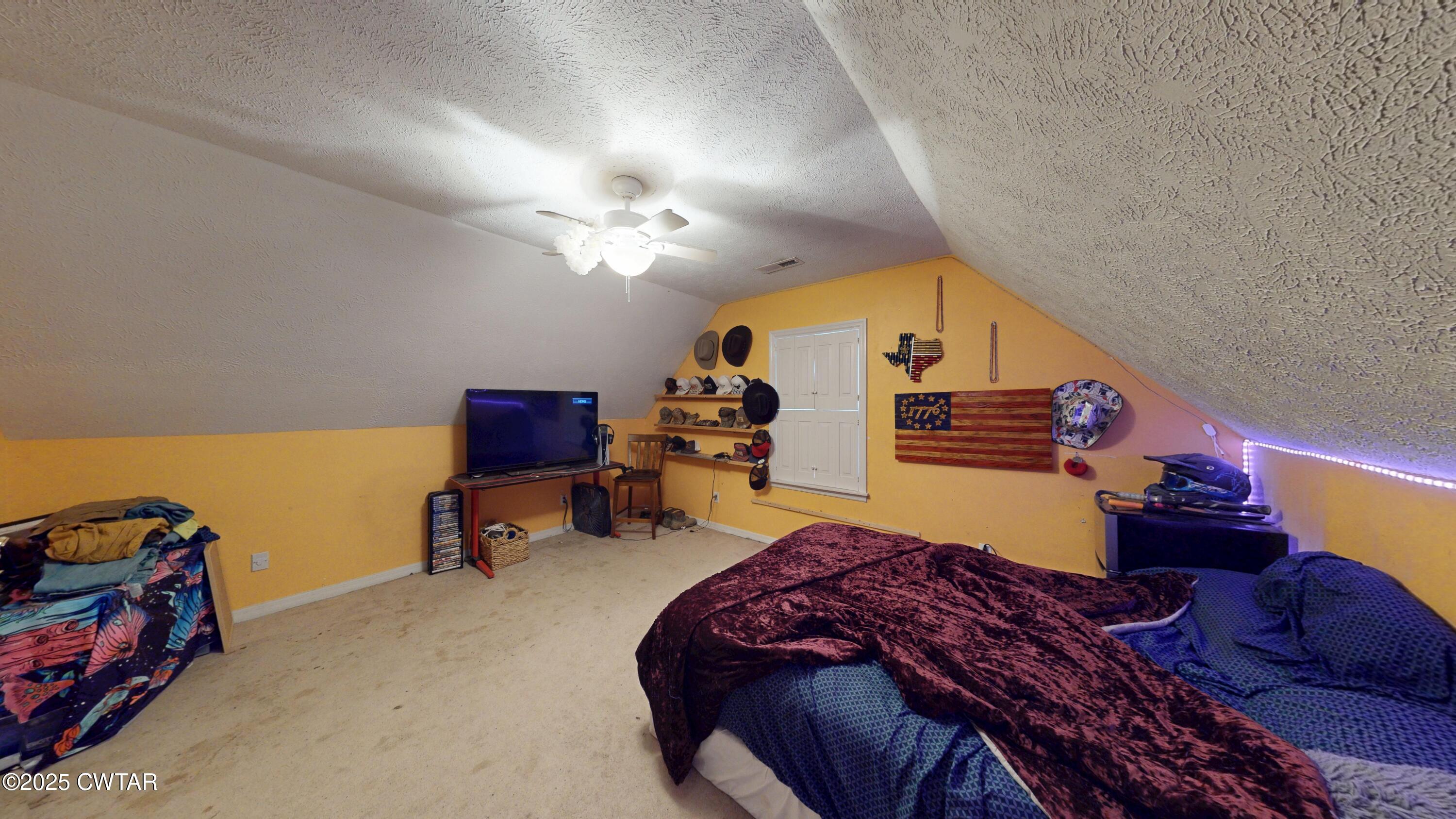 625 Hanna Drive Ripley, TN 38063 - Photo 15 of 26 a bedroom with bed and a chandelier