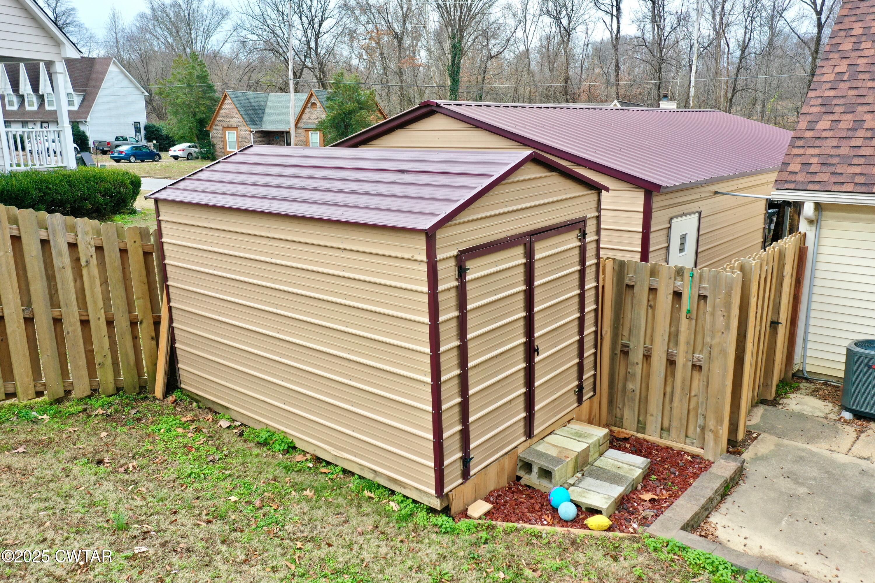625 Hanna Drive Ripley, TN 38063 - Photo 18 of 26 a view of a wooden house with a yard