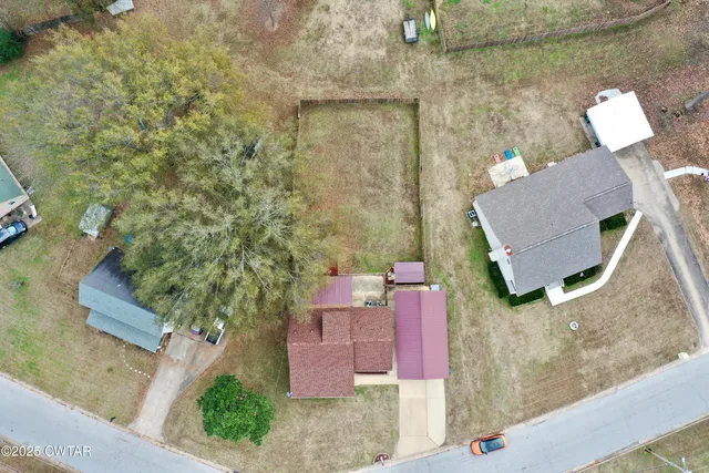 an aerial view of a house with swimming pool