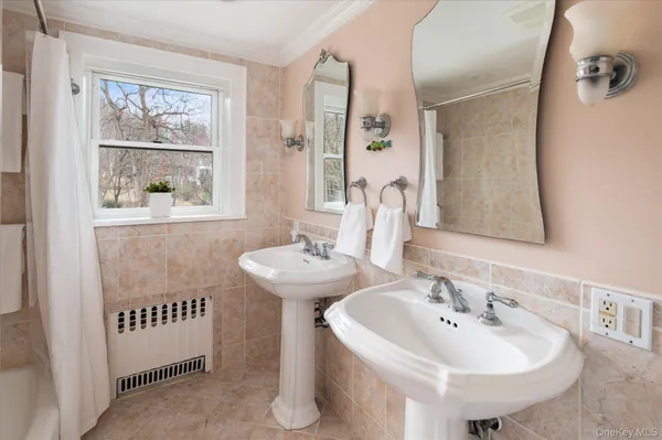 a bathroom with a sink and a window