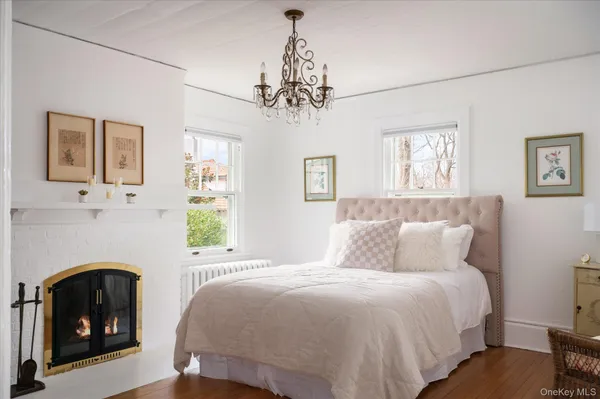 a bedroom with a bed and a fireplace