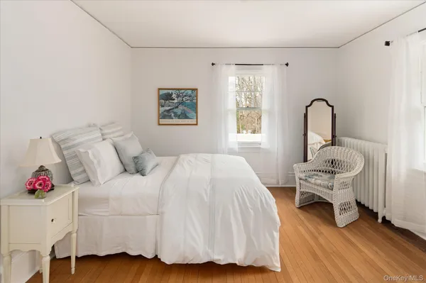 a bedroom with a bed and a table