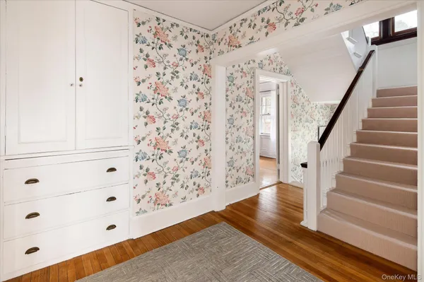 a view of entryway with wooden floor