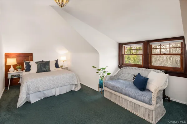 a spacious bedroom with a bed and window