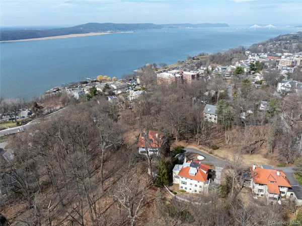 an aerial view of a house with a yard