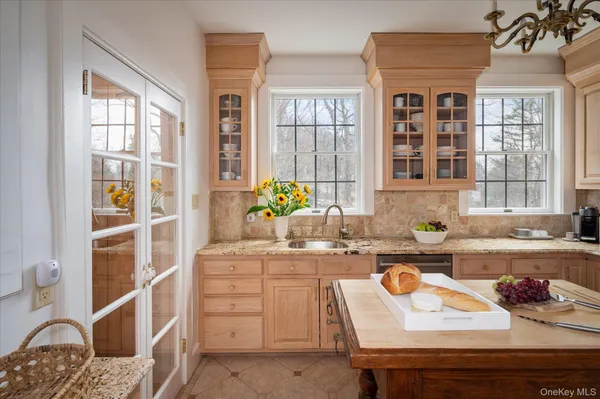 a kitchen with a sink stove and window