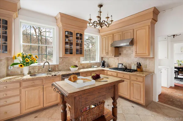 a kitchen with a sink stove and microwave