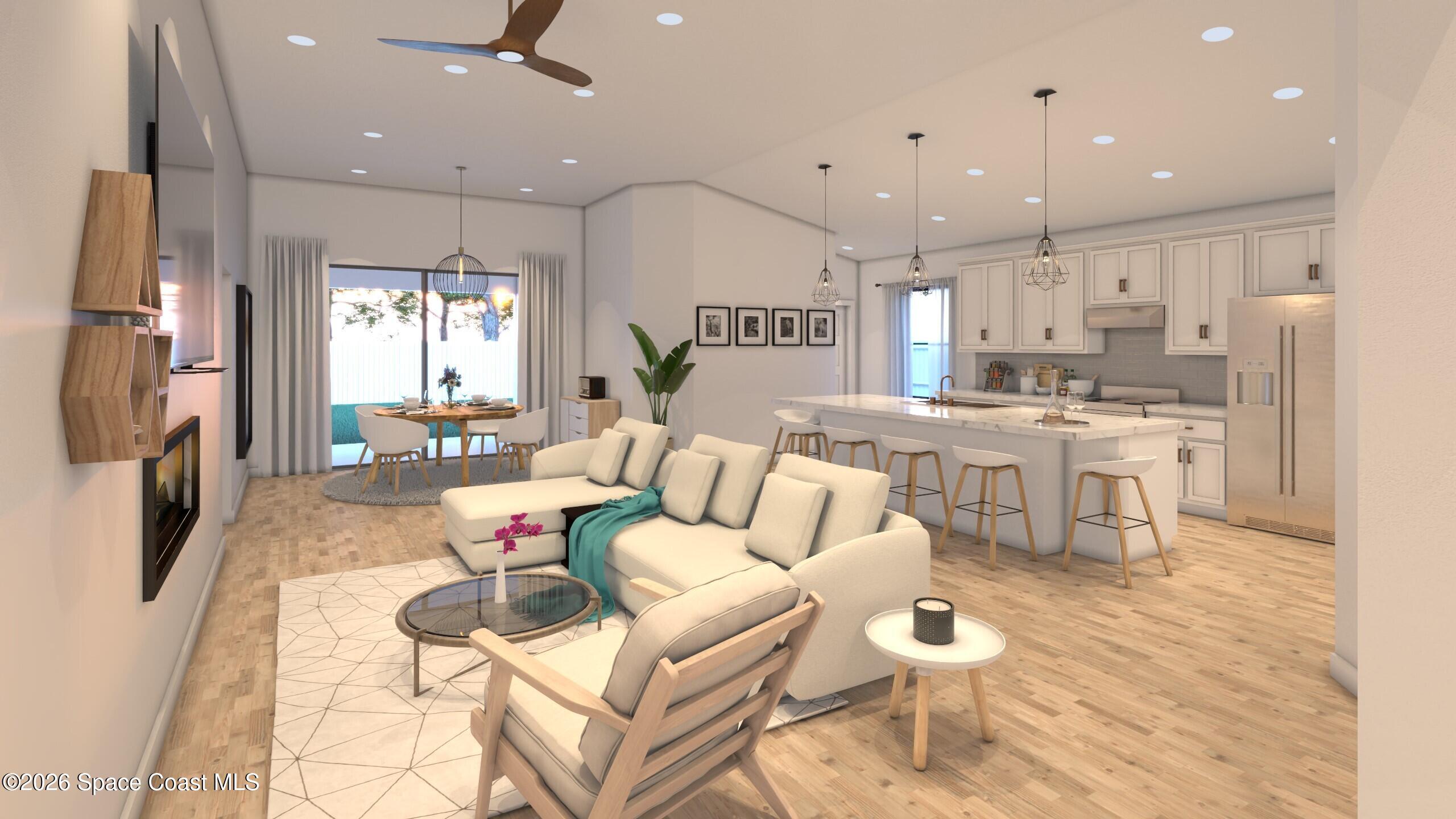 1850 Viburnum Road Northwest Palm Bay, FL 32907 - Photo 12 of 15 a living room with stainless steel appliances furniture a rug and a kitchen view