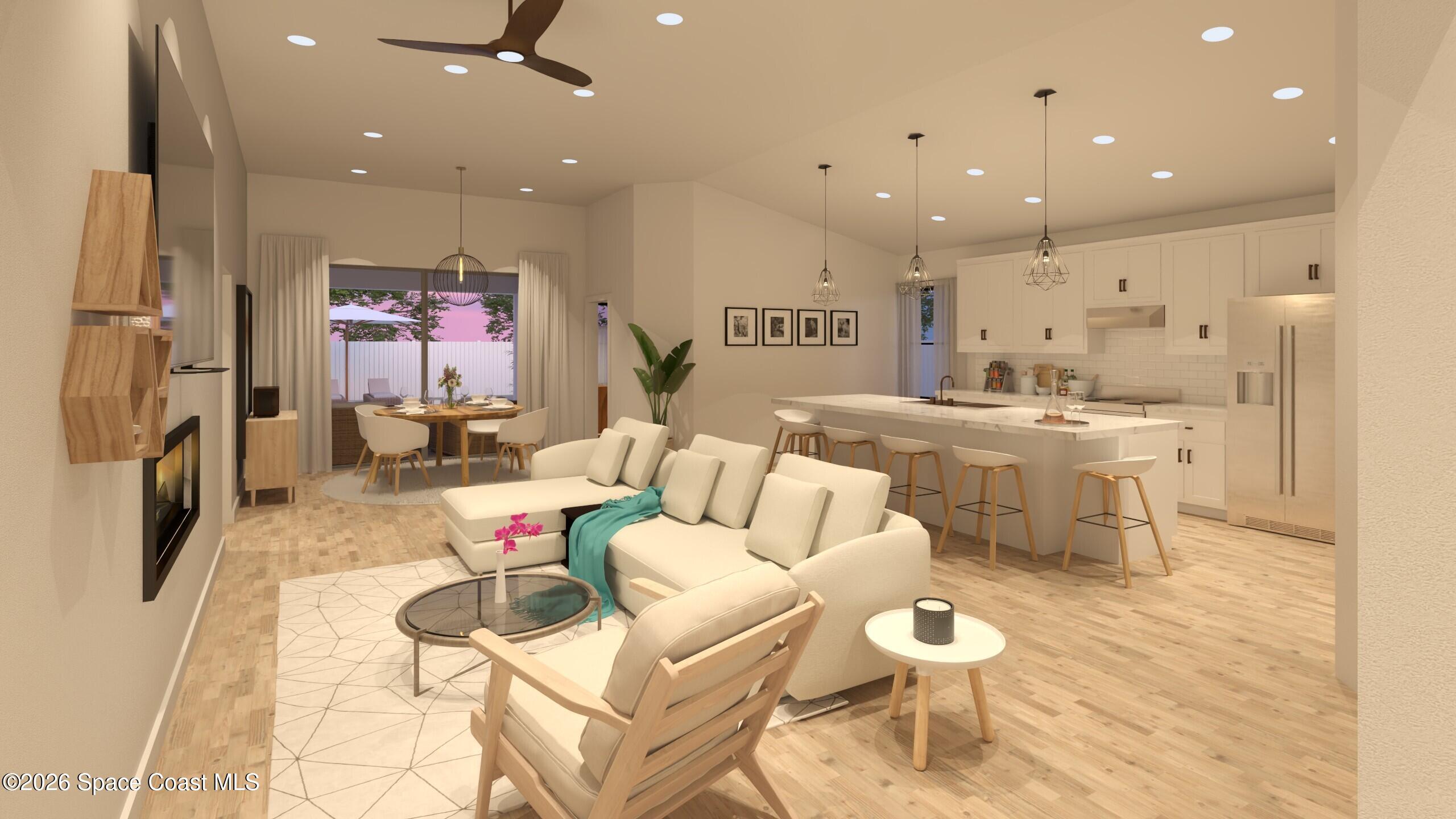 1850 Viburnum Road Northwest Palm Bay, FL 32907 - Photo 2 of 15 a living room with furniture a fireplace and a view of kitchen