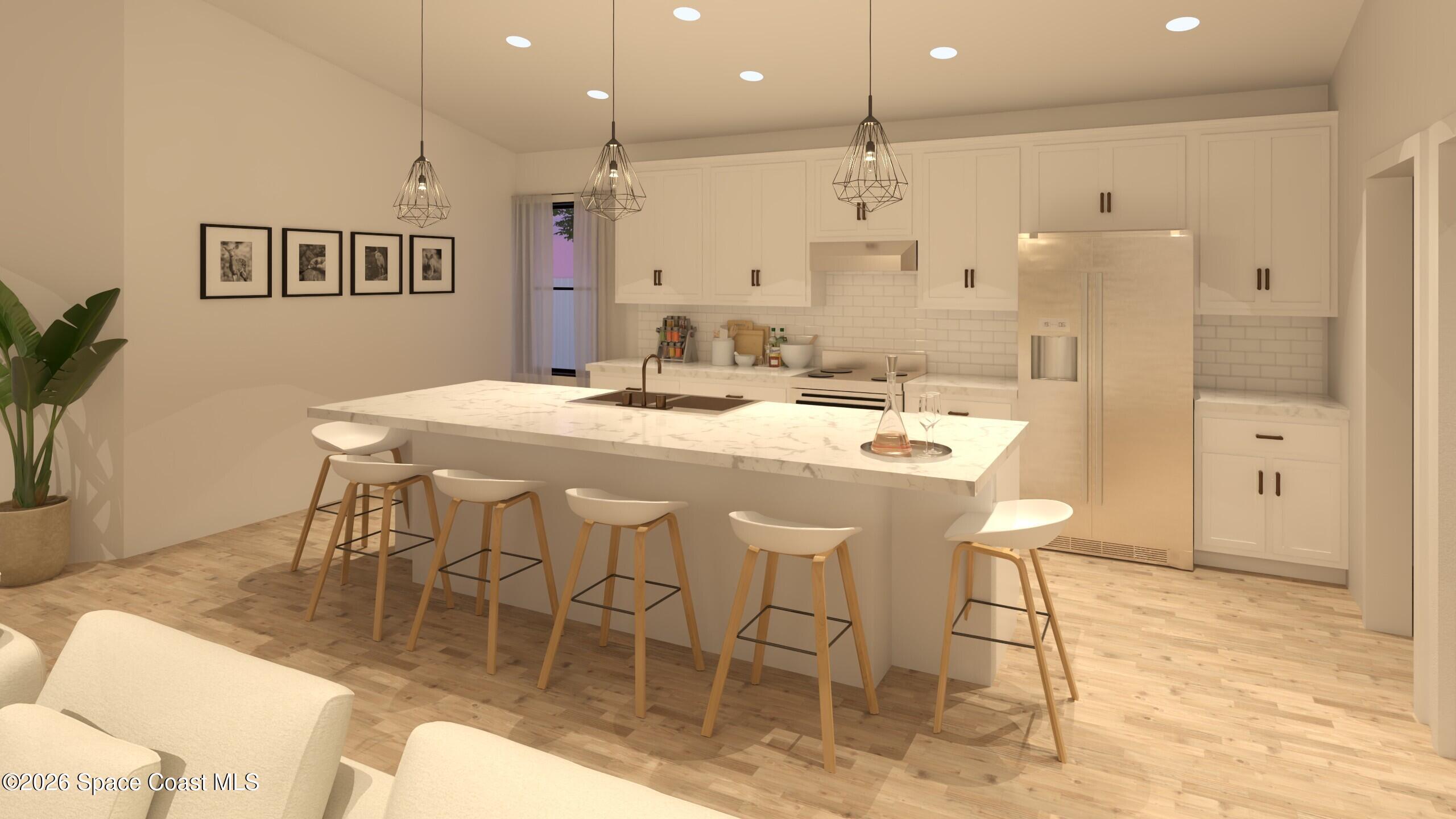 1850 Viburnum Road Northwest Palm Bay, FL 32907 - Photo 3 of 15 a large kitchen with a table and chairs