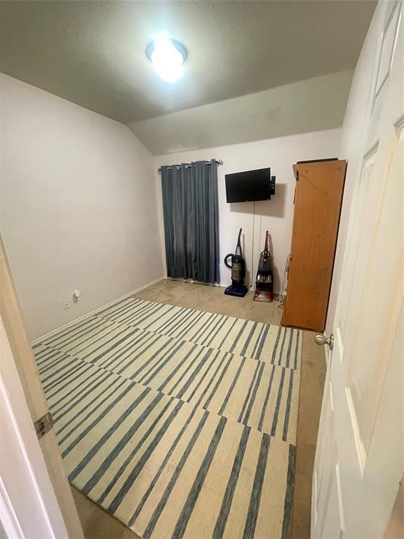 301 Long Prairie Drive Forney, TX 75126 - Photo 11 of 16 a bedroom with a bed and flat screen tv