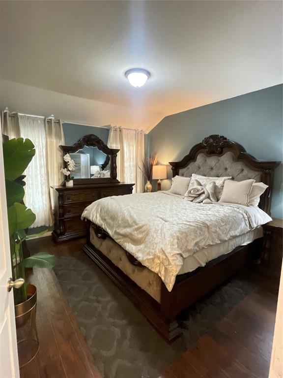 301 Long Prairie Drive Forney, TX 75126 - Photo 12 of 16 a bedroom with a bed and a mirror on dresser