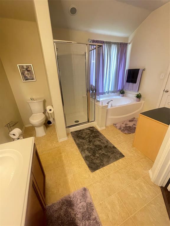 301 Long Prairie Drive Forney, TX 75126 - Photo 14 of 16 a bedroom with a bed and wooden floor