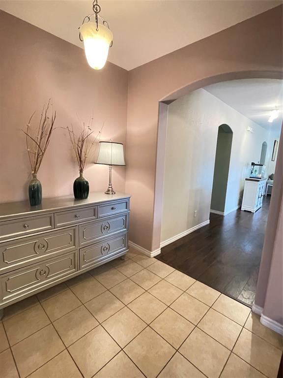 301 Long Prairie Drive Forney, TX 75126 - Photo 3 of 16 a view of a hallway to room with wooden floor