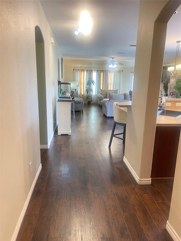 301 Long Prairie Drive Forney, TX 75126 - Photo 4 of 16 a view of a living room with kitchen view and a window