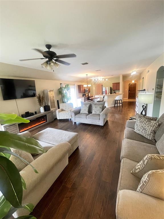 301 Long Prairie Drive Forney, TX 75126 - Photo 7 of 16 a living room with furniture and a wooden floor