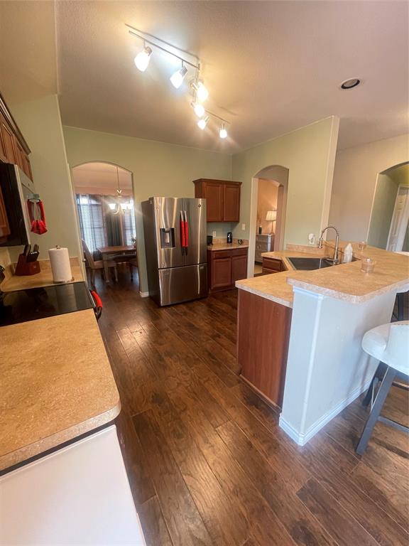 301 Long Prairie Drive Forney, TX 75126 - Photo 8 of 16 a room with furniture a flat screen tv and a table