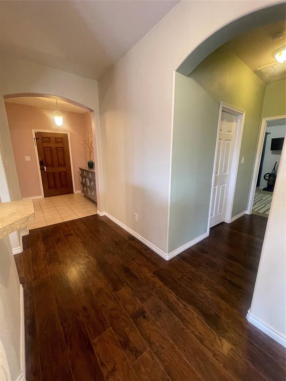 301 Long Prairie Drive Forney, TX 75126 - Photo 9 of 16 a view of a hallway with wooden floor