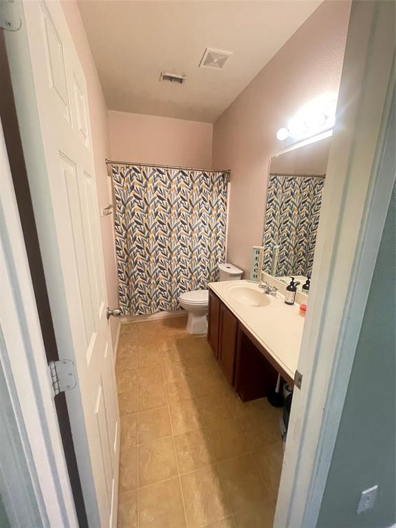 301 Long Prairie Drive Forney, TX 75126 - Photo 10 of 16 a bathroom with a double vanity sink toilet mirror and bathtub