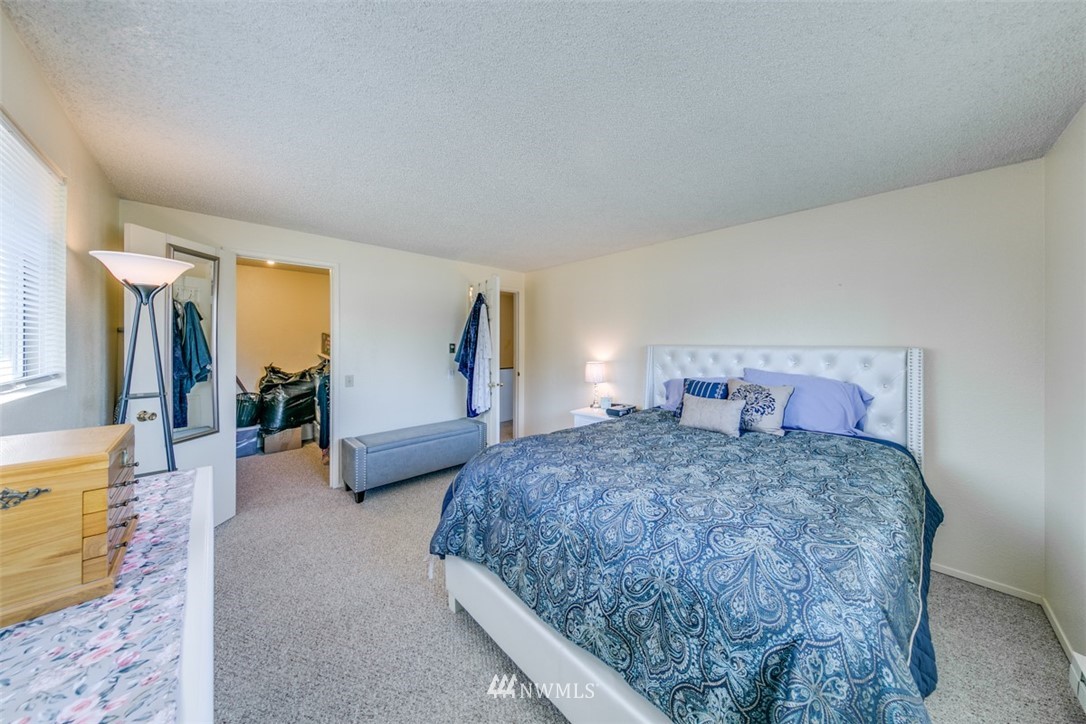 511 Terra Eden Street Forks, WA 98331 - Photo 17 of 21 a bedroom with a large bed and a couch