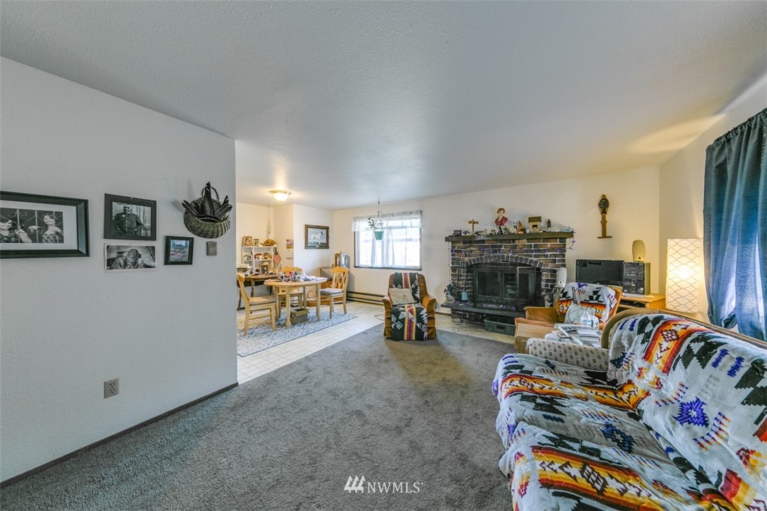 511 Terra Eden Street Forks, WA 98331 - Photo 6 of 21 a living room with furniture and a fireplace