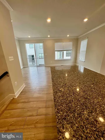 a view of livingroom and hardwood floor