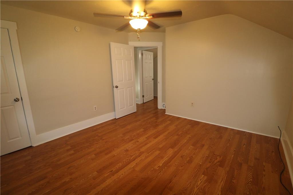 449 Spring Street Richeyville, PA 15358 - Photo 13 of 17 a view of an empty room with wooden floor