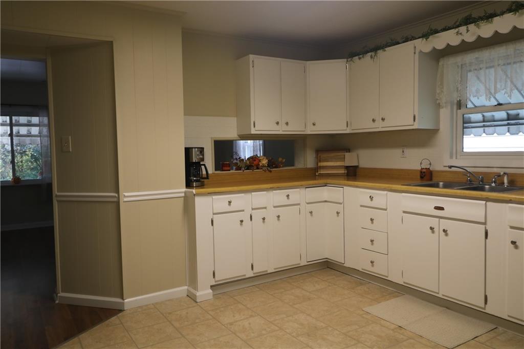 449 Spring Street Richeyville, PA 15358 - Photo 8 of 17 a kitchen with white cabinets and white appliances