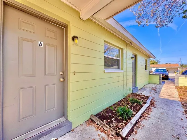 a view of a backyard door of the house