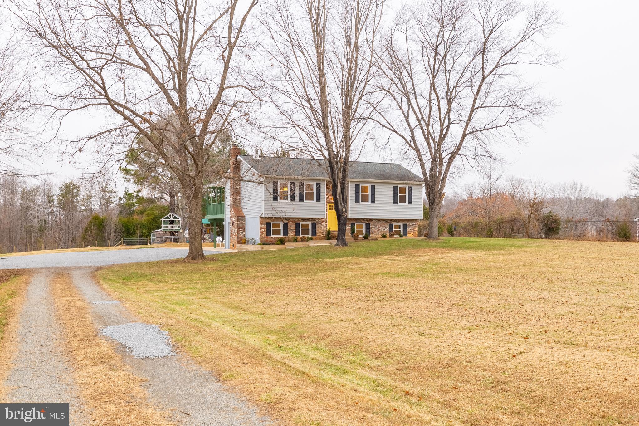 1251 Hartwood Road Fredericksburg, VA 22406 - Photo 16 of 28 a house with trees in front of it