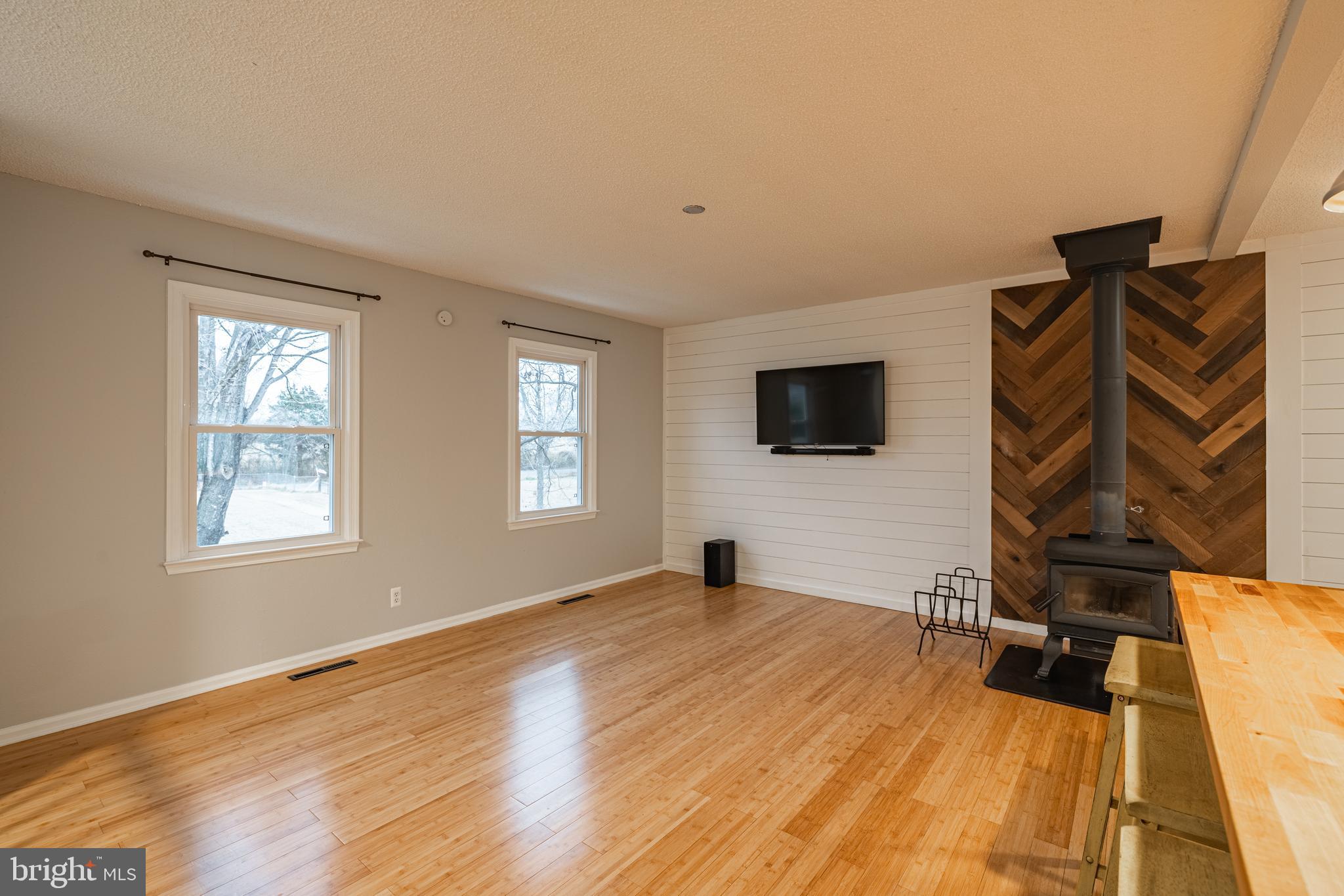 1251 Hartwood Road Fredericksburg, VA 22406 - Photo 7 of 28 a bedroom with a bed and a flat screen tv