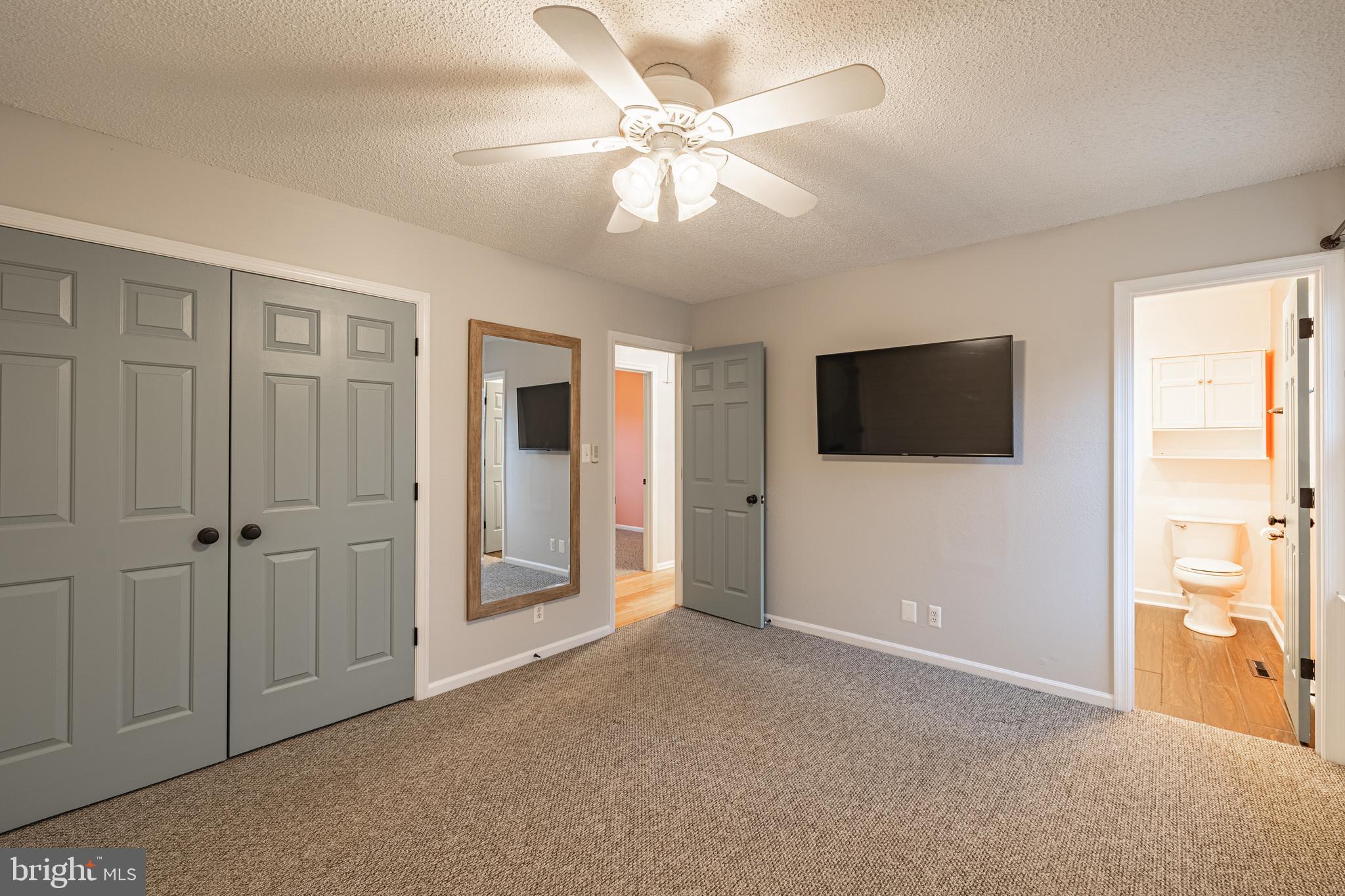 1251 Hartwood Road Fredericksburg, VA 22406 - Photo 9 of 28 a view of a livingroom with an empty space & a ceiling fan