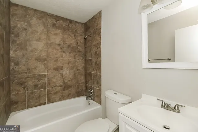 a bathroom with a sink and a bathtub