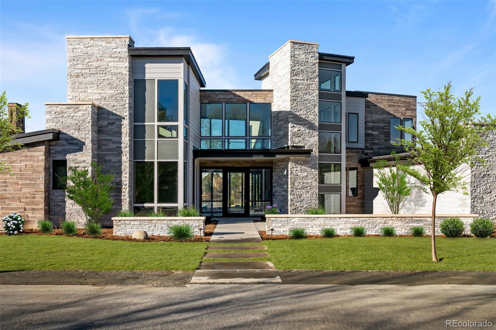 15 Sandy Lake Road Cherry Hills Village, CO 80113 - Photo 1 of 49 front view of a brick house with a yard