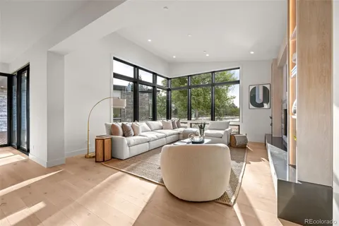 a view of a room with gym equipment and floor to ceiling window